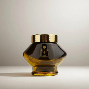 Bakhoor Kuwaiti incense featuring notes of white flowers, patchouli, and saffron in a luxury glass jar