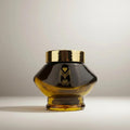 Bakhoor Kuwaiti incense featuring notes of white flowers, patchouli, and saffron in a luxury glass jar